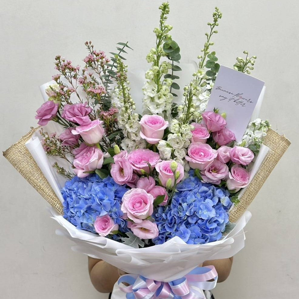 "Melts My Heart" Bouquet of Blue Hydrangea, Pink Roses, Llisianthus With White Delphiniums